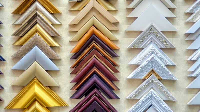 Custom professional picture framing workshop with various frame samples